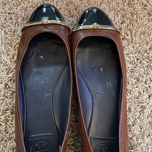 Brown leather and patent Leather Tory Burch flats.